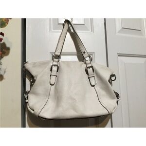 Michael KOR’s White Leather Side Pocket Zipper Purse